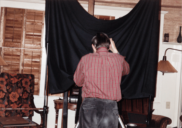a person looking into a black sheet