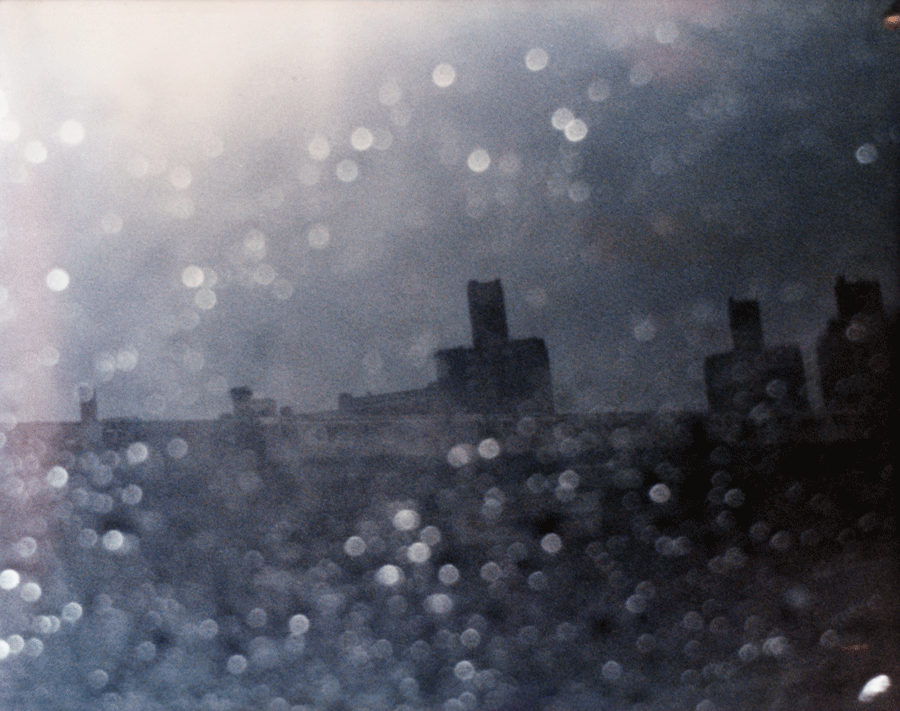 a cityscape behind the glass